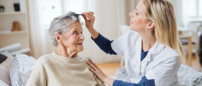 Elderly enjoying care and love by caregiver